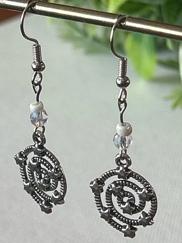 Handmade Silver Star Spiral Drop Earrings with White Bead Accent - Image 3