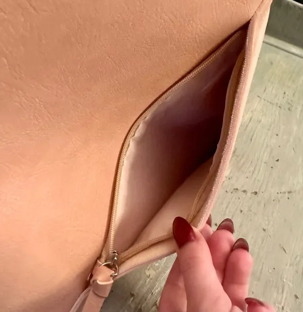 Hobo pink and tan shoulder bag with a unique asymmetrical design, featuring a side zipper closure - Image 3