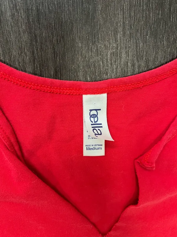Bella Canvas Comfortable red sleeveless V-neck top with Huskers chest logo. Soft, breathable fabric for everyday wear. Clean, fitted silhouette that layers easily. Machine washable for easy care. size medium - Image 2