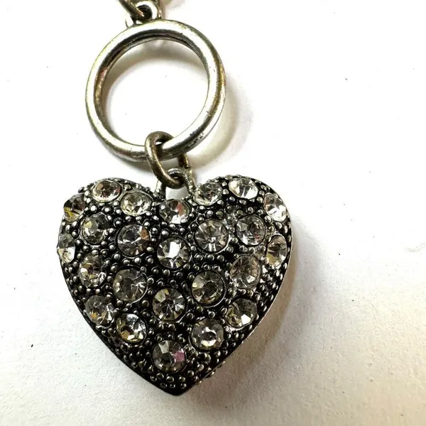 Silver tone bracelet with rhinestone heart charm - Image 2