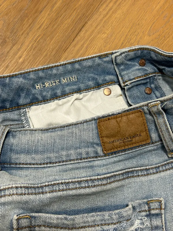 Size 4 American Eagle jean skirt with rips - Image 5