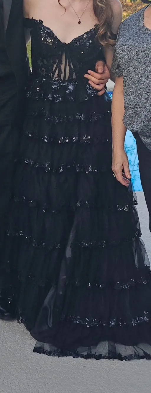 Dillard's off-the-shoulder, black, ruffle gown with sequin corset back - Image 3
