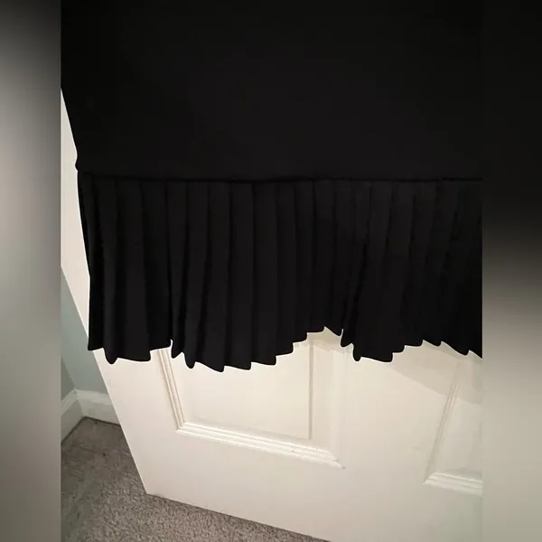 Black dress with ruffles at the bottom. - Image 5