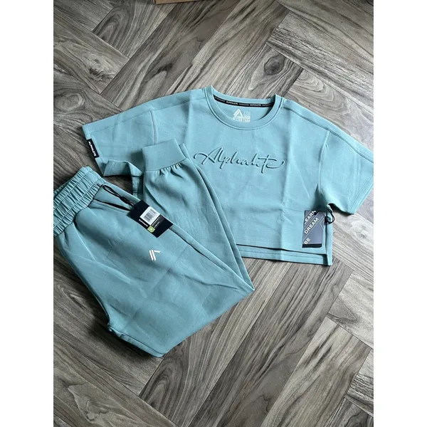 Set 2 Pcs Alphalete Women's ELMTS Short Sleeve Crop & Relaxed Coffed Jogger Teal - Image 5