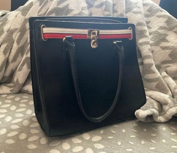 Black handbag/crossbody with red and white stipe Cheetah print interior design Plenty of zippers - Image 5