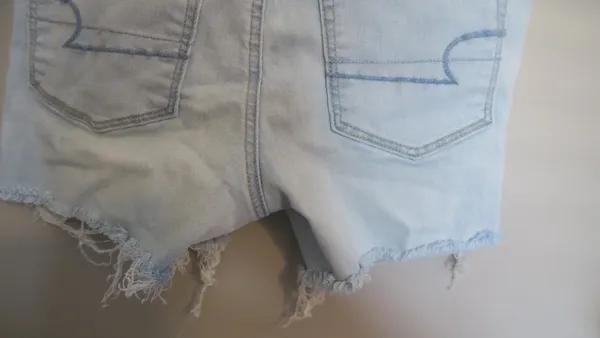 American Eagle Outfitters next level stretch hi-rise shortie jeans in light wash blue size 6. - Image 7
