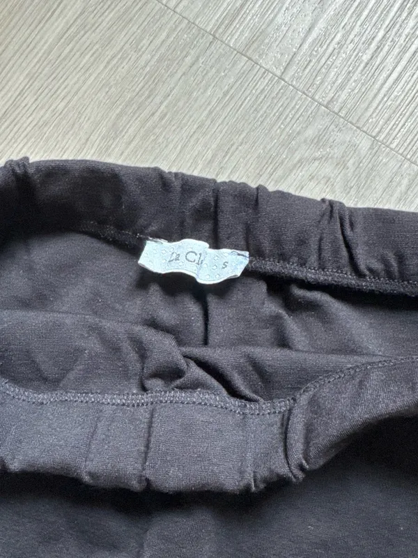 Classic Black Mini Skirt with Subtle Front Slit - Image 2