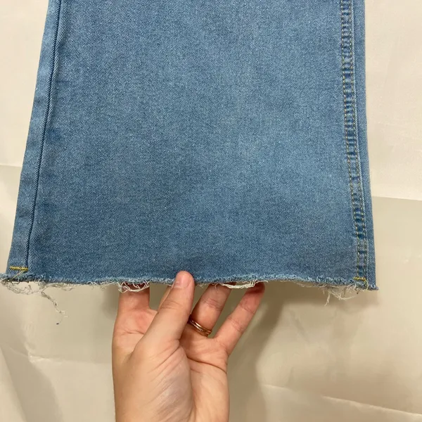 EUC Women’s medium/light wash‎ blue stretch flare leg distressed hem jeans XL - Image 3