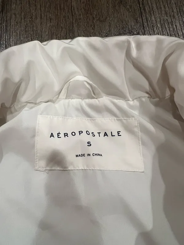 Aeropostale Stay warm and stylish with this sleek white puffer vest. Perfect for layering in cooler weather. - Image 2