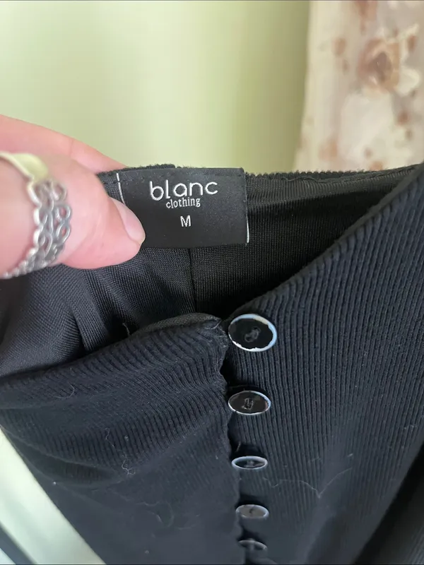 Blanc black ribbed-knit midi dress with asymmetric curved row of front buttons - Image 3