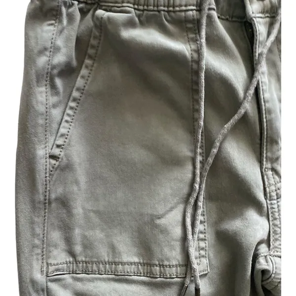 American Eagle -ARMY GREEN JOGGER PANTS-SIZE 2 Elastic waist with drawstring, zip front, two front and two back pockets, elastic ankles with a side zipper, excellent condition Measurements: Waist: side to side 13-16 inches Rise: 9 inches Inseam: 37 inches - Image 7