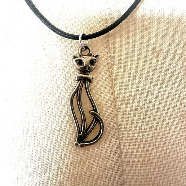 Silver tone cat pendant necklace on black cord - Image 2