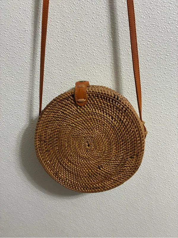 Round Woven RattanCrossbody Bag in Tan with leather strap & snap closure - Image 2