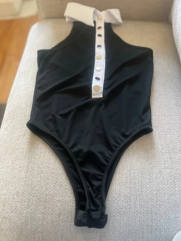 Seatyrocks Elevate your style with this chie black and white bodysuit. Perfect for any occasion, it features a sophisticated button- up design - Image 3
