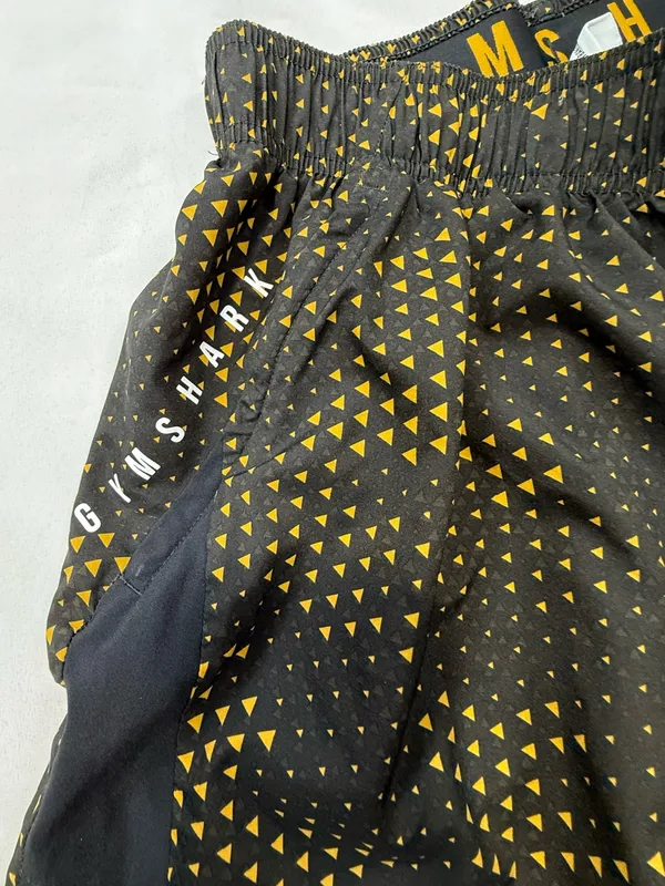 Gymshark Black Shorts with Gold Triangle Print - Image 3