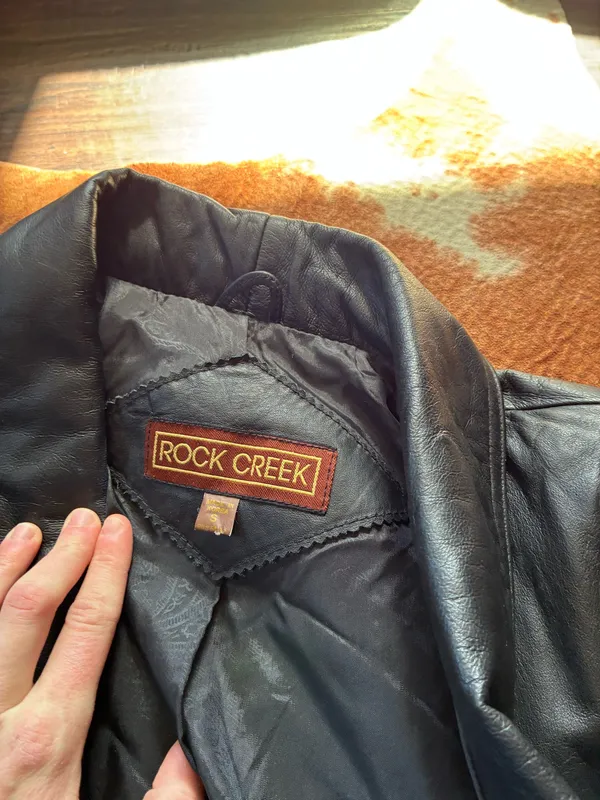 Vintage Black leather Rock Creek trench coat size small The outer shell is 100% genuine leather The lining in Nylon! Missing 1 button on the right side in pictures 1-4 not noticeable or even a snag there!!! - Image 9