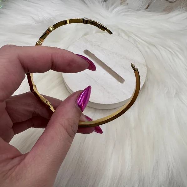 This chic bracelet showcases a beautiful gold finish with delicate white heart d - Image 6