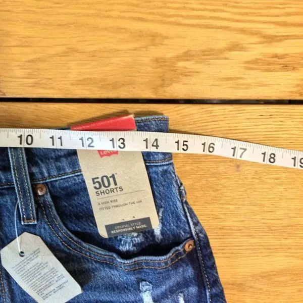 NWT Levi’s 501 Jean shorts 28 button-fly medium wash raw hem - Image 2