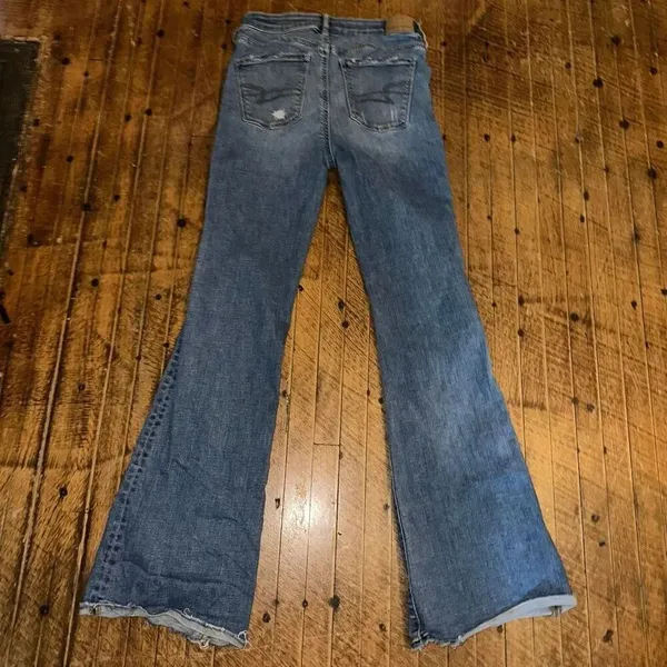 American Eagle distressed 0 hi-rise flare raw hem jeans - Image 3