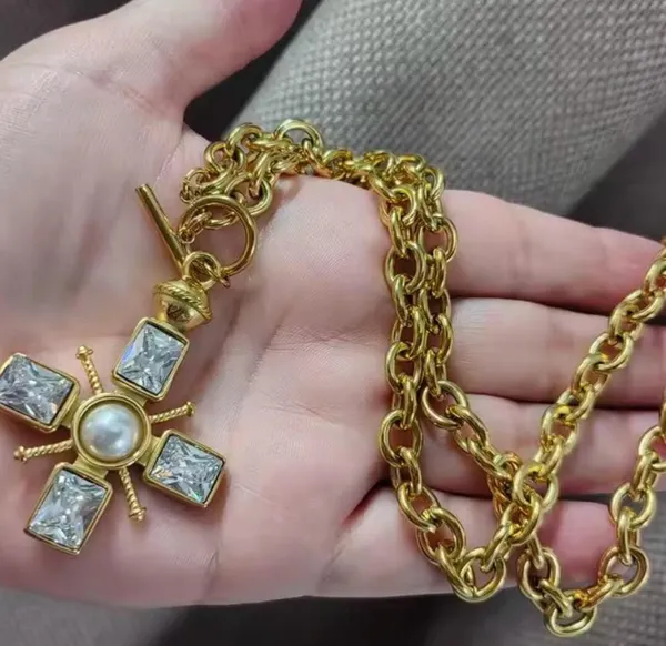 Chunky gold cross necklace with pearl and toggle clasp - Image 4