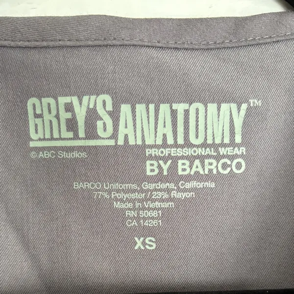 Grey's Anatomy by Barco Riley 3-Pocket Mock Wrap V-Neck Top Size XS - Image 3