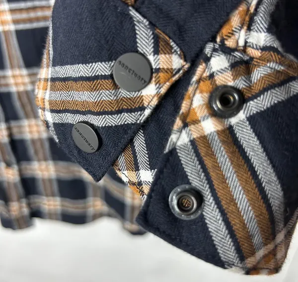 Classic Sanctuary navy plaid tunic-style button front shirt featuring a relaxed fit, chest pockets, and roll-tab sleeves for versatile styling. Lightweight and easy to wear with leggings, denim, or layered over a tank. Great casual staple for fall and transitional seasons - Image 5