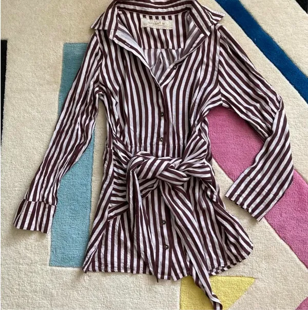 Jen’s Pirate Booty Amaya brown and white striped mini dress in size XS. This has only been worn once and has no rips, tears, or stains. Some color transfer between stripes from washing but it’s not really noticeable as seen in photos. The waist can be tied in front with excess or in back (I like to go around twice and tie in back). Ultra soft and flowy material, love this dress and only selling as it just isn’t quite my style. Measures 30” long, 17” across chest, 14” across at waist, 22” long sleeve (from shoulder seam). - Image 2