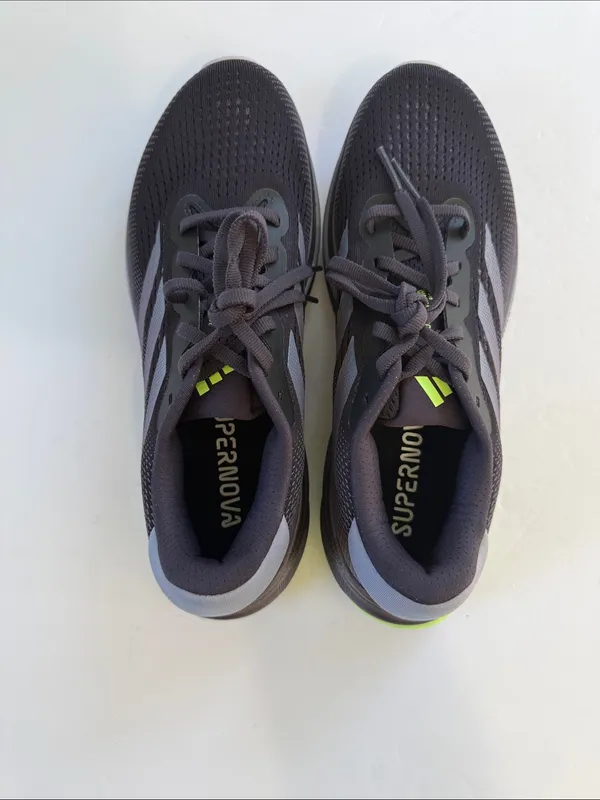 adidas women’s Black Athletic Shoes with White Stripes and Neon Green Accent - Image 6