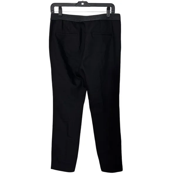 ZARA BASIC Collection Black trousers zip hem Back stripe straight leg size Lg The ZARA BASIC Collection Black trousers are stylish dress pants in size L with a zip hem feature and back stripe accents. Made from a fabric blend of blended polyester, these pants have a straight leg style and pockets for added convenience. Perfect for casual occasions in the summer, fall, and spring, these trousers are machine washable for easy care. The black pants with stripes offer a city-inspired theme, making them a versatile and chic addition to any woman's wardrobe. - Image 3