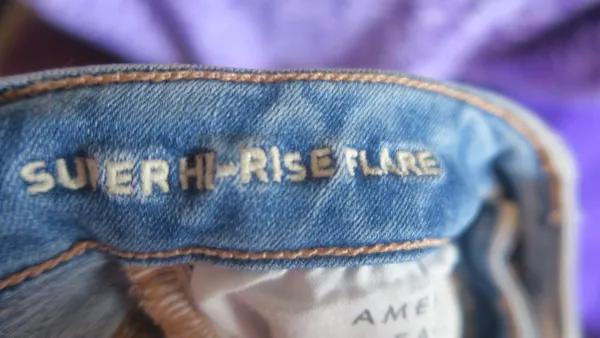 American Eagle Outfitters next level stretch super hi-rise flare jeans in medium wash blue size 4. - Image 14