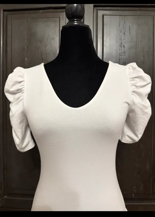 Vylette White bodysuit with Puffy Sleeves - Size Medium. ***refer to measurements. Super Cute top gentle worn and in excellent condition. Cotton/ spandex material. Measurements approximately for the bodysuit/ 14” from armpit to armpit x 25” from shoulder to snaps in crotch. Non-smoking home. Priced to sell at as is condition. Don’t like my price please make reasonable offer. - Image 2