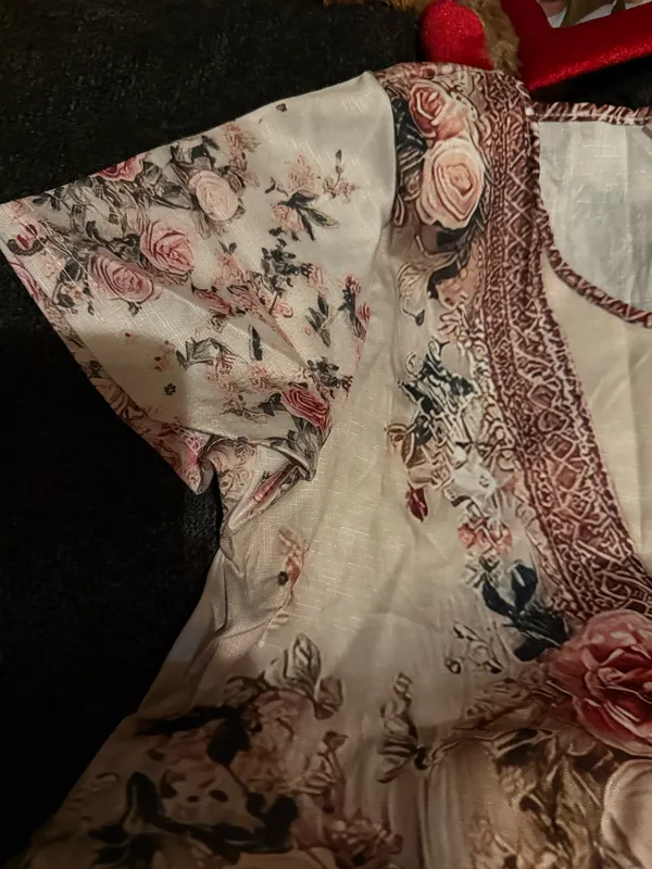 Elegant blush pink floral maxi dress with a V-neck and soft flowing fabric. Features romantic rose print and subtle lace-trim detail at the neckline. Lightweight and feminine for day or evening wear. Blush pink color complements neutral accessories. - Image 3