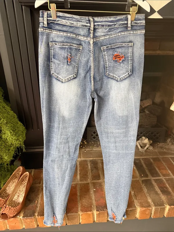 Women's Distressed Blue Denim Jeans with Orange Patch Details - Image 2