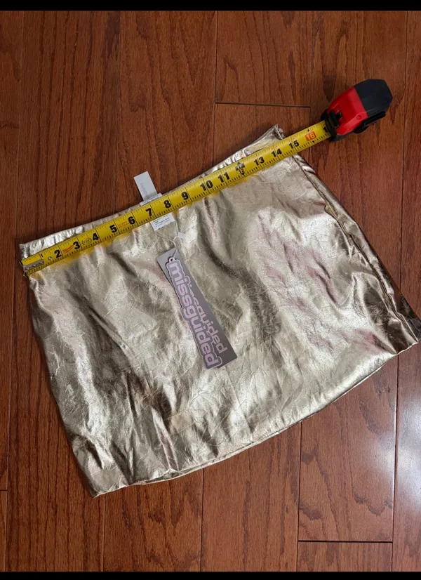 Missguided Gold faux leather skirt - size Smal NWT ***Refer to measurements. Beautiful skirt to wear out on a party trip. Fun & spunky. Measurements approximately 15” waste x 14” long. Non- smoking home. priced to sell at as is condition. Don’t like my price, make reasonable offer! And thank you for checking my closet. - Image 6