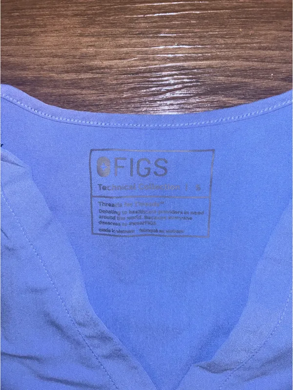 Figs women’s ceil blue scrub top with Aya Healthcare logo - Image 3