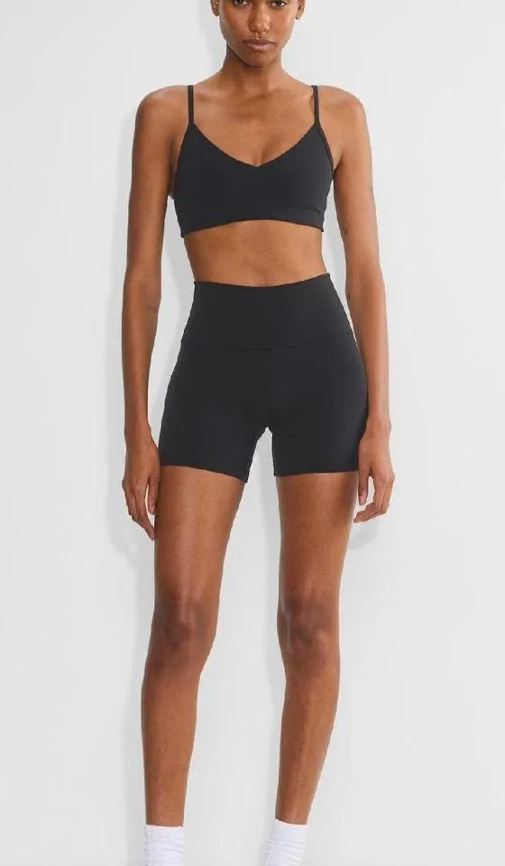 Aritzia Tna Butter Set this set comes with cheeky biker shorts, hold tight bra, and butter bound t-shirt all in black set retails for $136 - Image 7