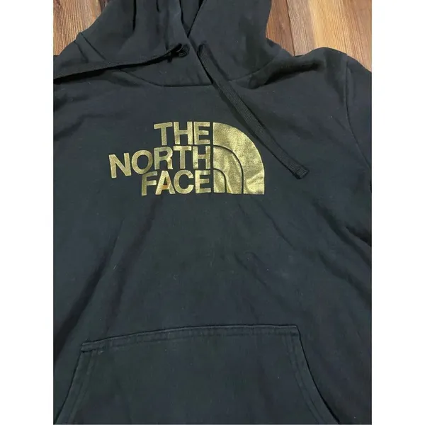 The North‎ Face black hoodie with gold graphic size medium - Image 7