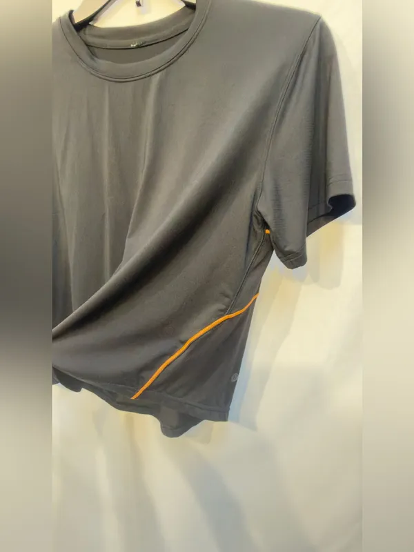 Lululemon Ventilated Open-Back Training T-Shirt in Black with Orange Soda trim - Image 6