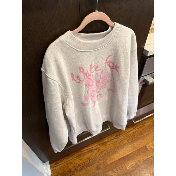 White Fox Boutique sweater features a pink floral graphic L-XL - Image 2