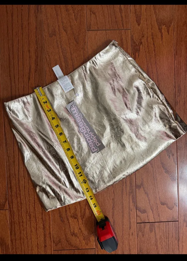 Missguided Gold faux leather skirt - size Smal NWT ***Refer to measurements. Beautiful skirt to wear out on a party trip. Fun & spunky. Measurements approximately 15” waste x 14” long. Non- smoking home. priced to sell at as is condition. Don’t like my price, make reasonable offer! And thank you for checking my closet. - Image 7