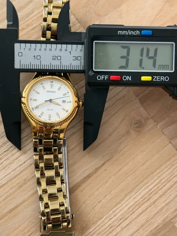 Seiko Vintage Watch Gold Bracelet Case White Dial Blue Gold Hands Date Window - Image 13