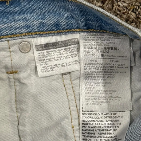Vintage Levi's 501 light wash distressed jeans. Waist 27 (2" inseam) - Image 7