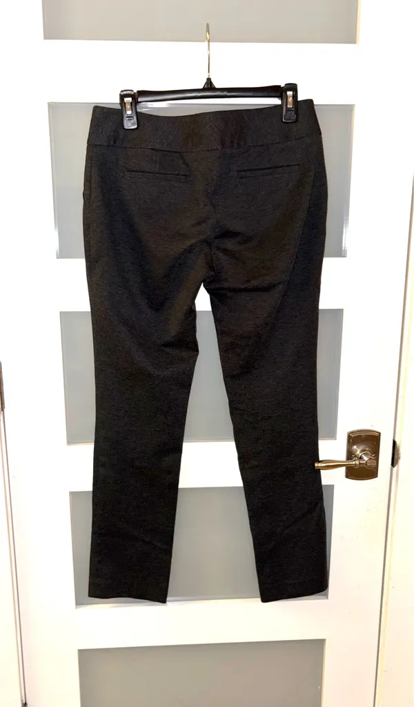 Vince Camuto straight-cut, mid-rise black pants with subtle texture are ideal for a formal or office style. - Image 2