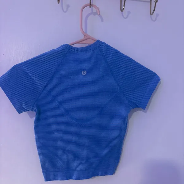 Lululemon Swiftly Tech Cropped T-Shirt 💗 Size:0 In excellent condition with no stains, holes, or tears. Only worn a few times and still looks great! This top is lightweight, breathable, and perfect for workouts, cheer, running, or everyday wear. ✨ Details: * Authentic Lululemon * Swiftly Tech fabric * Cropped length * Smoke-free home * Ready to ship! Feel free to . 😊 - Image 2