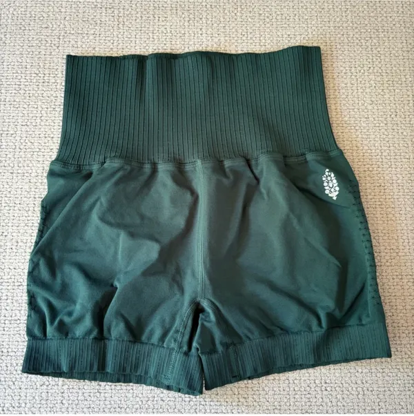 Free People NWOT Good Karma Running Shorts Radiant Blue XS/S NO exterior logo With a holds-you-in high rise and super-soft feel, these ultra-flattering running shorts transition to the track, trails and beyond. Plus, Breathable pinhole details make for a wear-every-day, no-fuss fit. Equipped with SPF 30 UV protection Ribbed, compressive waistband Super stretchy fit Ribbed hems that won’t ride up Measurements for size extra small/ small Inseam: 2.75 in Waist (Relaxed): 20 in Hips (relaxed): 24 in Rise: 9.5 in Contents 27% Spandex 73% Nylon - Image 5