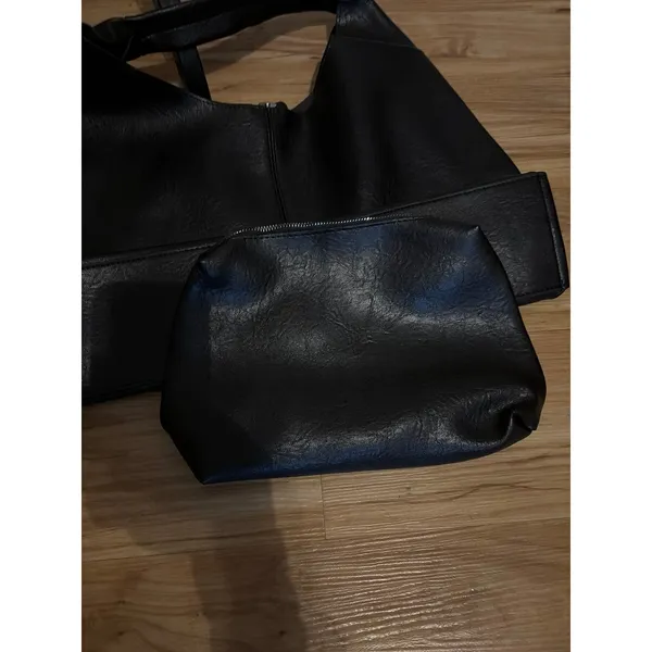 Black slouchy vegan leather shoulder bag with an unstructured, triangular hobo d - Image 3