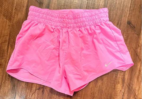 pink Nike One Dri-FIT running shorts with an elastic waistband and brief lining - Image 2