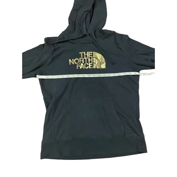 The North‎ Face black hoodie with gold graphic size medium - Image 2