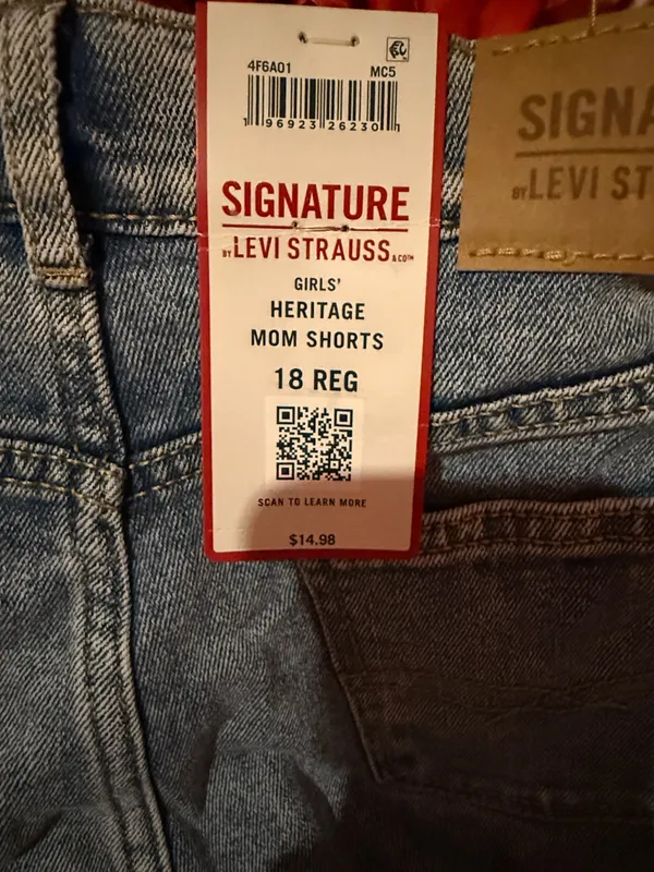 Signature Levi Strauss light blue denim shorts with delicate floral embroidery. Comfortable high-rise fit designed for everyday wear. Soft, faded blue wash that pairs easily with casual tops. Floral detailing adds a feminine touch. - Image 8
