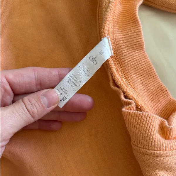 Discolored alo yoga orange crop crew neck sweatshirt size medium - Image 2